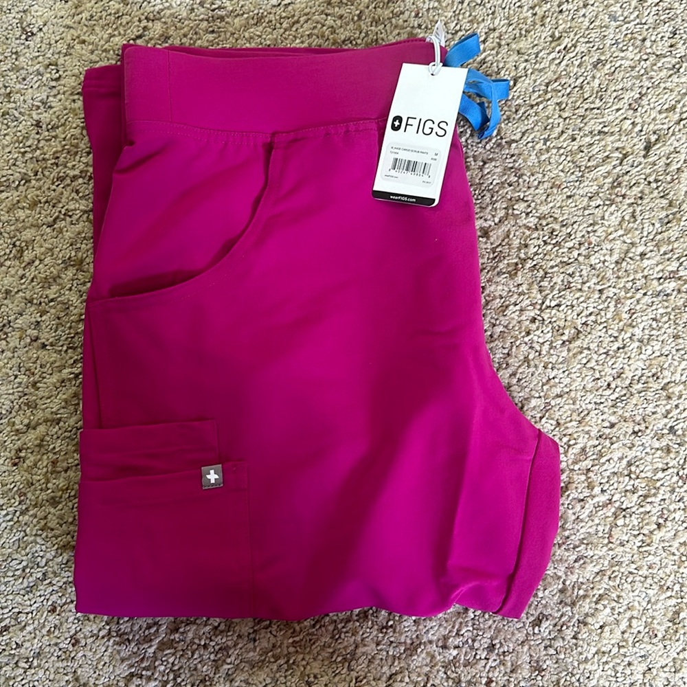 FIGS Medium Kade Cargo scrub pants in the color rasberry